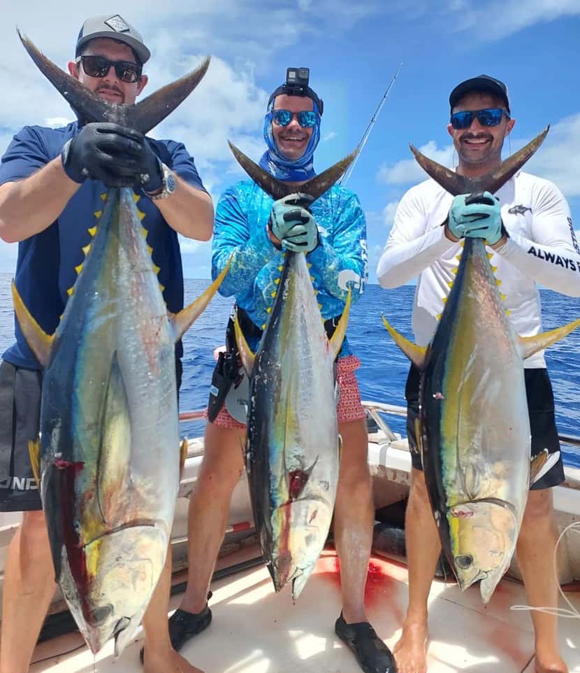 Deep sea fishing rods and net on a boat